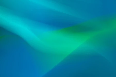 Темно-синий фон с яркими изумрудными и бирюзовыми световыми лучами, расходящимися по диагонали